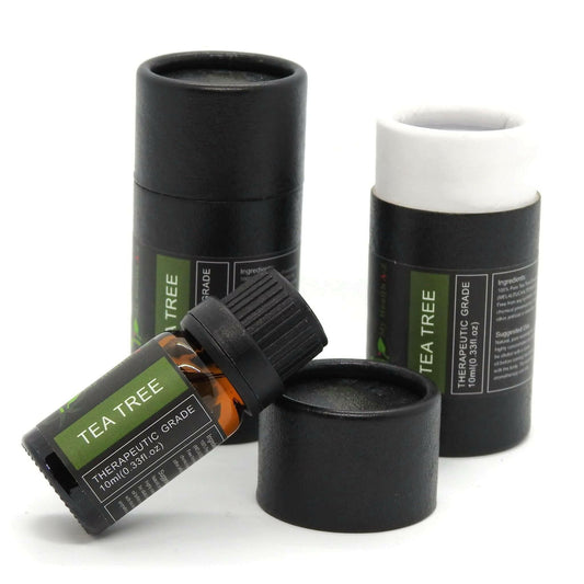 Tea Tree Essential Oil with one cylinder closed and another lid opened